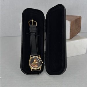 Vintage Affirmed Black and Gold Watch with Horse Design lot W2